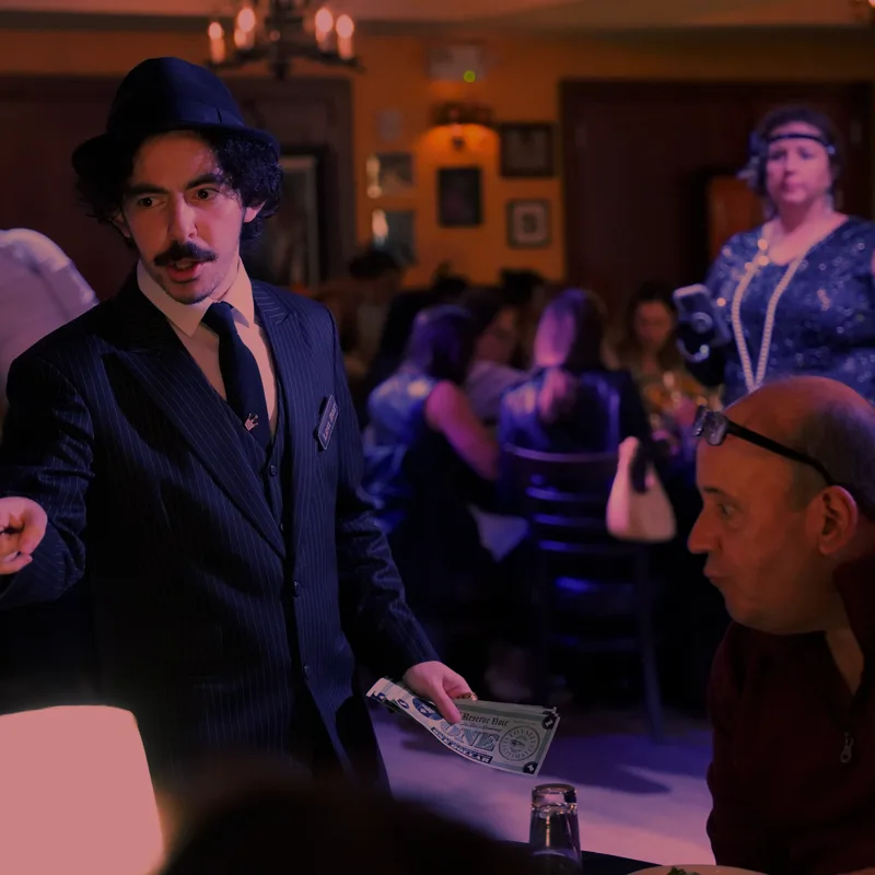A detective questioning a guest at a Fargo show